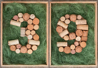 Number 39 thirty nine  made of wine corks on green background in wooden box