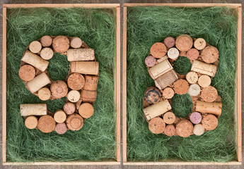 Number 98  ninety eight  made of wine corks on green background in wooden box
