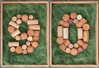 Number 90 ninety made of wine corks on green background in wooden box