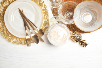 Elegant table setting and space for text on light background, top view