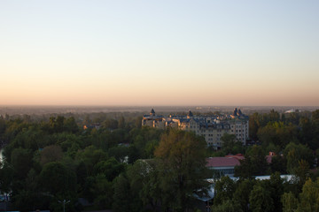 view of the city and the lake at sunset in Almaty