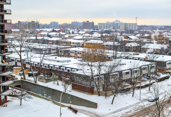 Modern condo buildings with huge windows in snow, Montreal, Canada. 