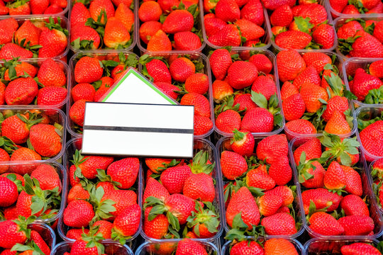 Boxes of strawberries and whitebord for text