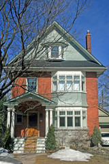 Obraz premium Birck House with Green Woodwork