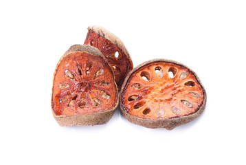 Aegle marmelos. Dry bael fruit isolated on white background.Dried herbs and dried bael fruit drink Healthy and Natural Food concept