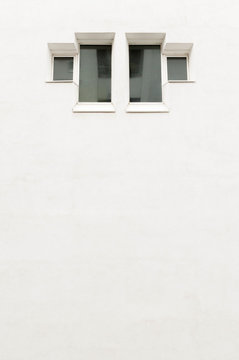 Minimalist window on empty wall. Residential building.