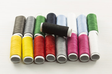 Several bobbins on white