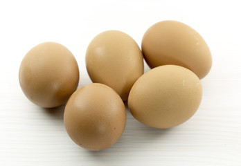 five eggs on a white table
