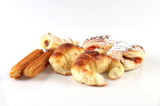 Typical Argentina sweet pastry usually eaten on breakfast called &ldquo;Facturas&rdquo; placed on a wooden table.