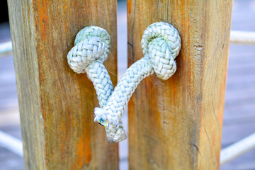 wood and rope with knotTied, architecture, rafter, rope, decoration, external, laçp, wood, square...