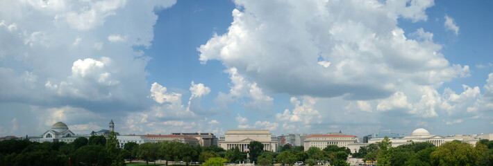 Cumulus clouds fill the sky over the National Mall in Washington, DC. National Archives are at center, Nstional Museum of Natural History at left, National Gallery of Art is at far right.