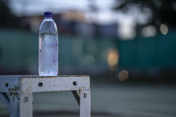 The beginning of a champion, Close up bottlel on the courts background.