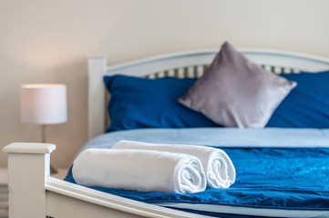 Fototapeta na wymiar Towels on bed background