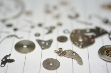 Detail of watch machinery on the table.