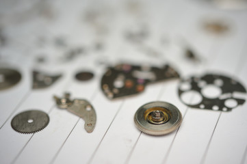 Detail of watch machinery on the table.