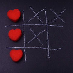 A game of love with a reminder of the game TIC TAC toe, someone will win, someone will lose