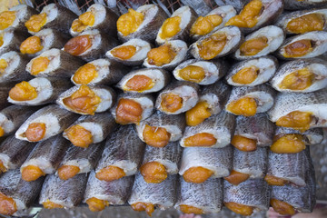 Row of dry fish. Dry fish for fried to eat. Food preservation in thailand.
