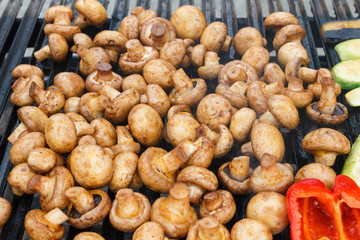 Mushroom barbecue, fried on a metal grill. Picnic in the open air