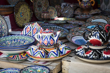 Plates and pots on a street Chorsu bazaar in the city of Tashkent, Uzbekistan.