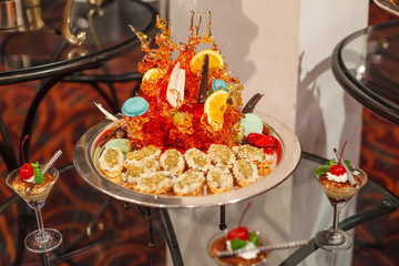 green jelly puff pie pastry appetizer Assortment with candy art decor. Hotel restaurant food catering service buffet cocktail banquet for wedding ceremony, seminar, meeting, conference, party or event