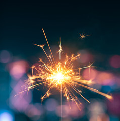 Burning sparkler with blurred background