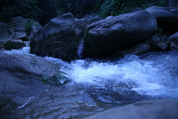 Water flowing between rocks in stream