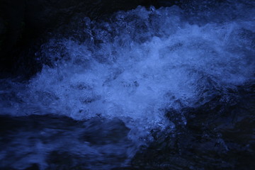 Pure crystal water spalsh with dark blue background in azad kashmir