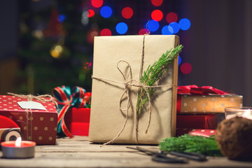 Christmas gift with decoration on wooden table