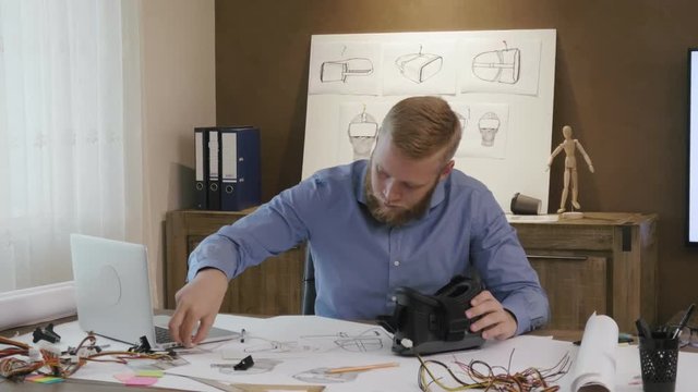 vr engineer puts on vr headset and try it out