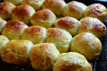 A tasty homemade buns on baking sheet