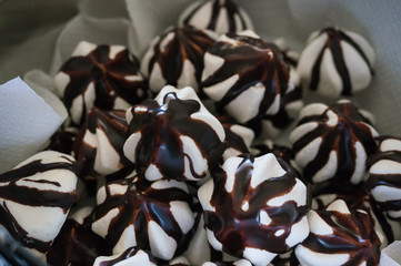 Marshmallow dessert covered with chocolate close up