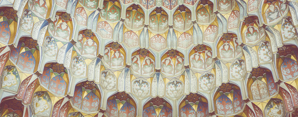 Decorative patterns and architectural details at the main entrance of Abdullaziz Khan madrasah in Bukhara, Uzbekistan