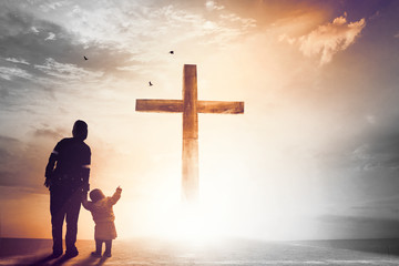 Praise and worship concept:Silhouette of Christian prayers raising hand while praying to the Jesus