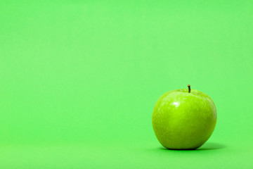 Green apple isolated on gray background