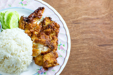 Fried Chicken and Rice in Plate on Wooden Floor ,fast food,in thailand