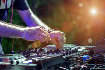 controller dash board takes command by DJ is rhythm music with Controller and mixer. DJ is playing...