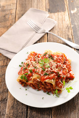 canneloni with beef and tomato sauce