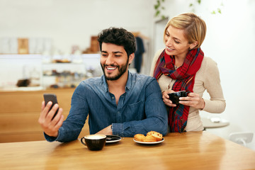 Happy People Using Phone In Cafe, Taking Photos