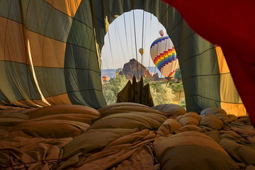 Turkey, Cappadocia - folding the balloon cup after the flight over the Cappadocia mountains