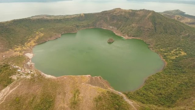 aerial footage lake crater at taal Volcano Luzon Philippines. Volcano with crater on an island in middle lake. Travel concept. Aerial video.