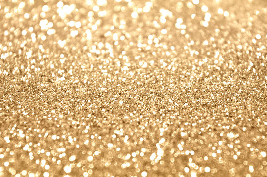 Blurred background with golden glitter in vintage colors