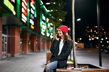 Happy Woman Talking On Phone On Street In Evening