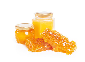 jar of honey and stick isolated on white background