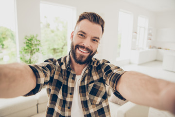 Young attractive brunet man with big toothy smile take selfie on