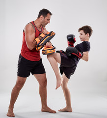 Kickboxer kid and his coach