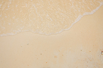 sand of beach and soft wave backgroun