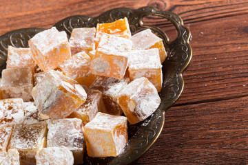 Turkish delight on a wooden table.
