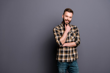 Fototapeta premium Portrait of young happy brunet man in brown checkered shirt and 