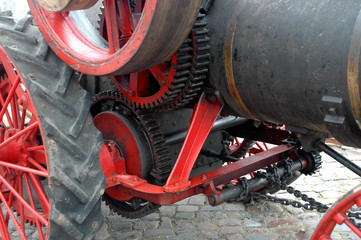 Fototapeta premium Close up on the gear wheels of an old steam tractor.