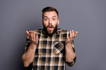 Portrait of bewildered man in casual wear look at camera isolate